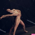 Two flexible dancer young man and woman in modern art performance isolated on black studio background. Art motion inspiration concept. Stock Photo vova130555 521537738
