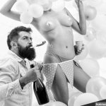 Strip dance for birthday surprise. Nude sexy female strip dancer birthday surprise. Idea for bachelor party. Party for adult. Birthday stripper for him. Man bearded bachelor celebrate birthday Stock Photo