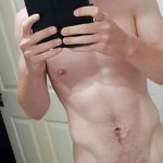 Nude boy taking a selfie