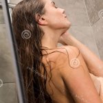 Girl Taking Shower and Covering Breast Stock Photo