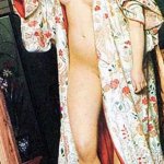 A Caucasian woman nude stands on the porch of a Japanese bath house she is nude except for her bathing kimono Poster Print by James Tissot