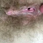 Hairy girl fucks her wet big clit pussy with dildo in close up